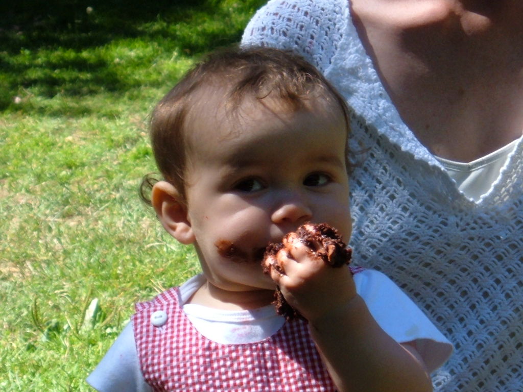 Margot eating cake - 1st birthday party